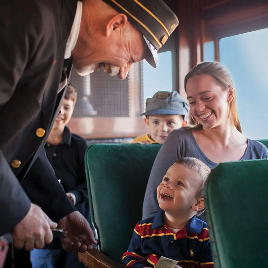 Boy and mom smiling on Strasburg Railroad train ride.