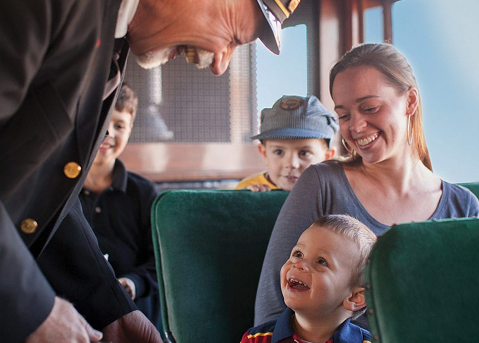 Boy and mom smiling on Strasburg Railroad train ride.