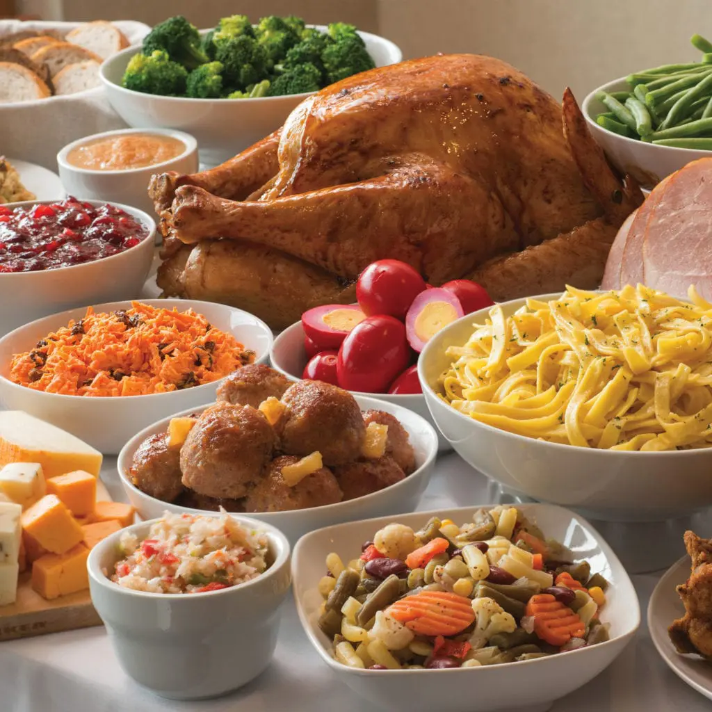 An example of the generous spread of Amish-style, family-style food served at Bird-in-Hand Family Restaurant & Smorgasbord: Roasted Turkey, Butter Noodes, Amish Beatballs, Roasted Vegtables and Pickled Eggs, among more items on a table.